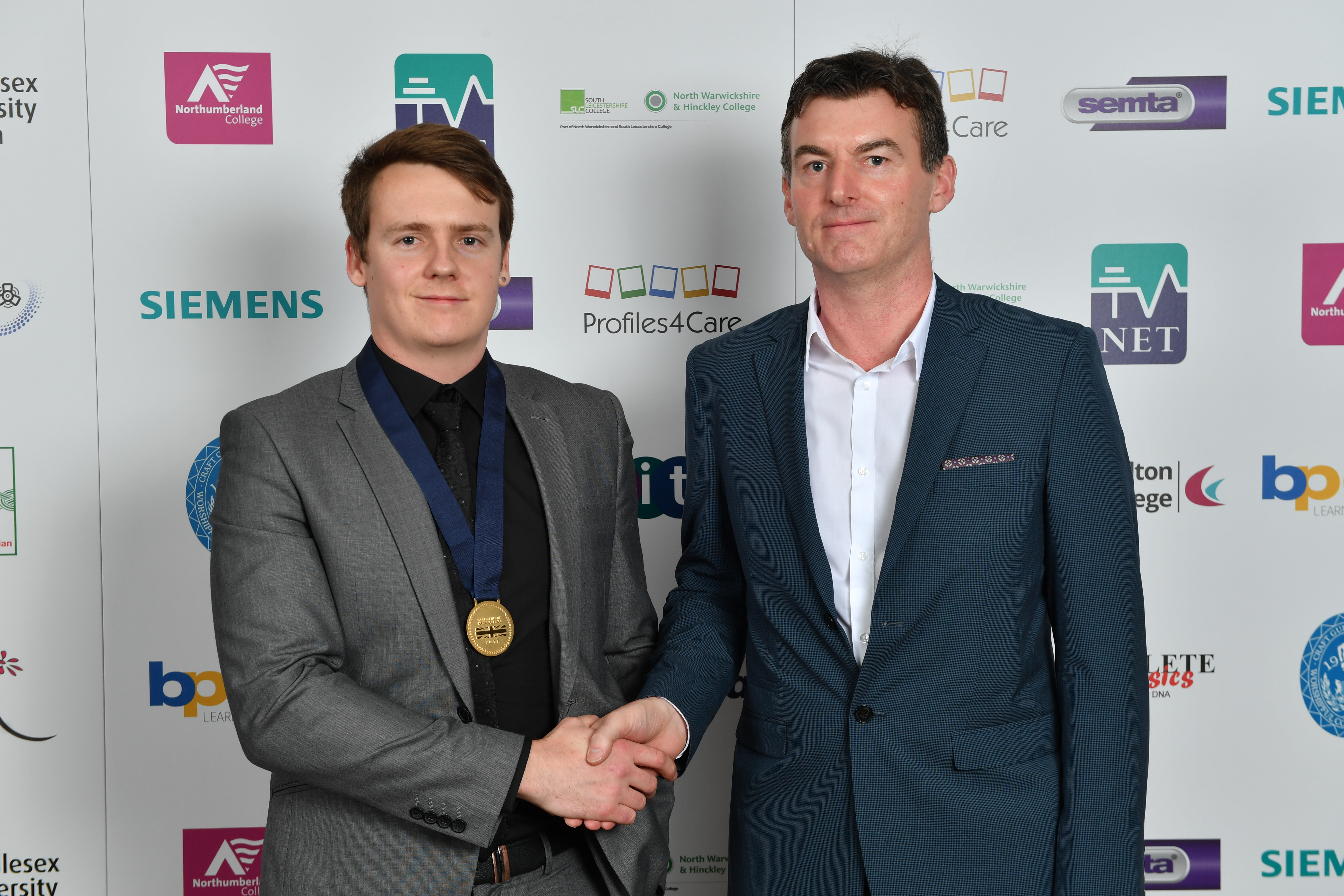 Ben Pick is pictured with his gold medal and Oliver Farrell, CITB SkillBuild Product Manager.