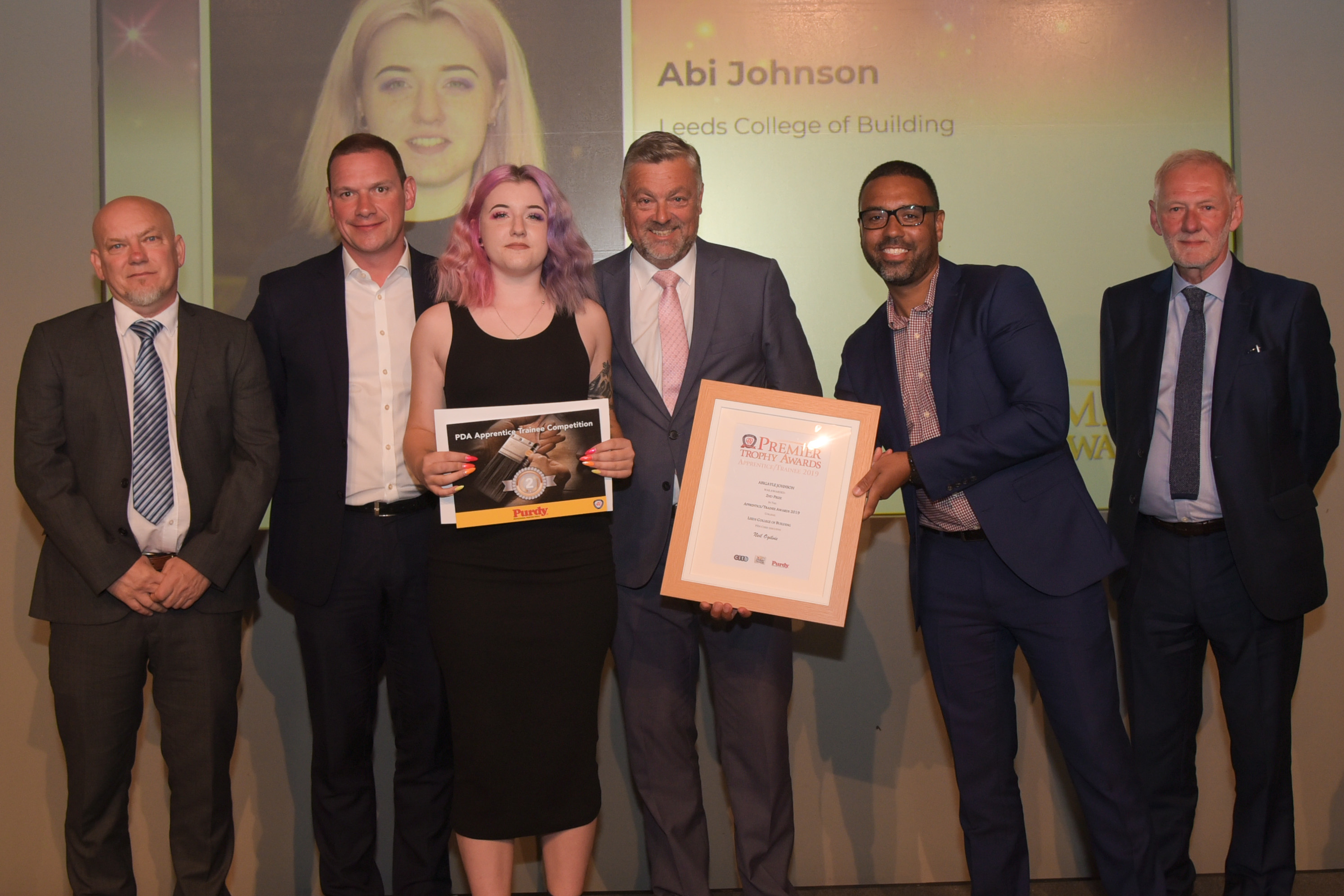 Apprentice Abi Johnson Winner (L to R): Mark Howroyd (Leeds College of Building), Alistair McAuley (Akzonobel [Dulux Trade]), Abi Johnson, Rob Davis (Purdy), Nathan Wilkins (CITB), Andrew Davis (Association of Painting Craft Teachers)