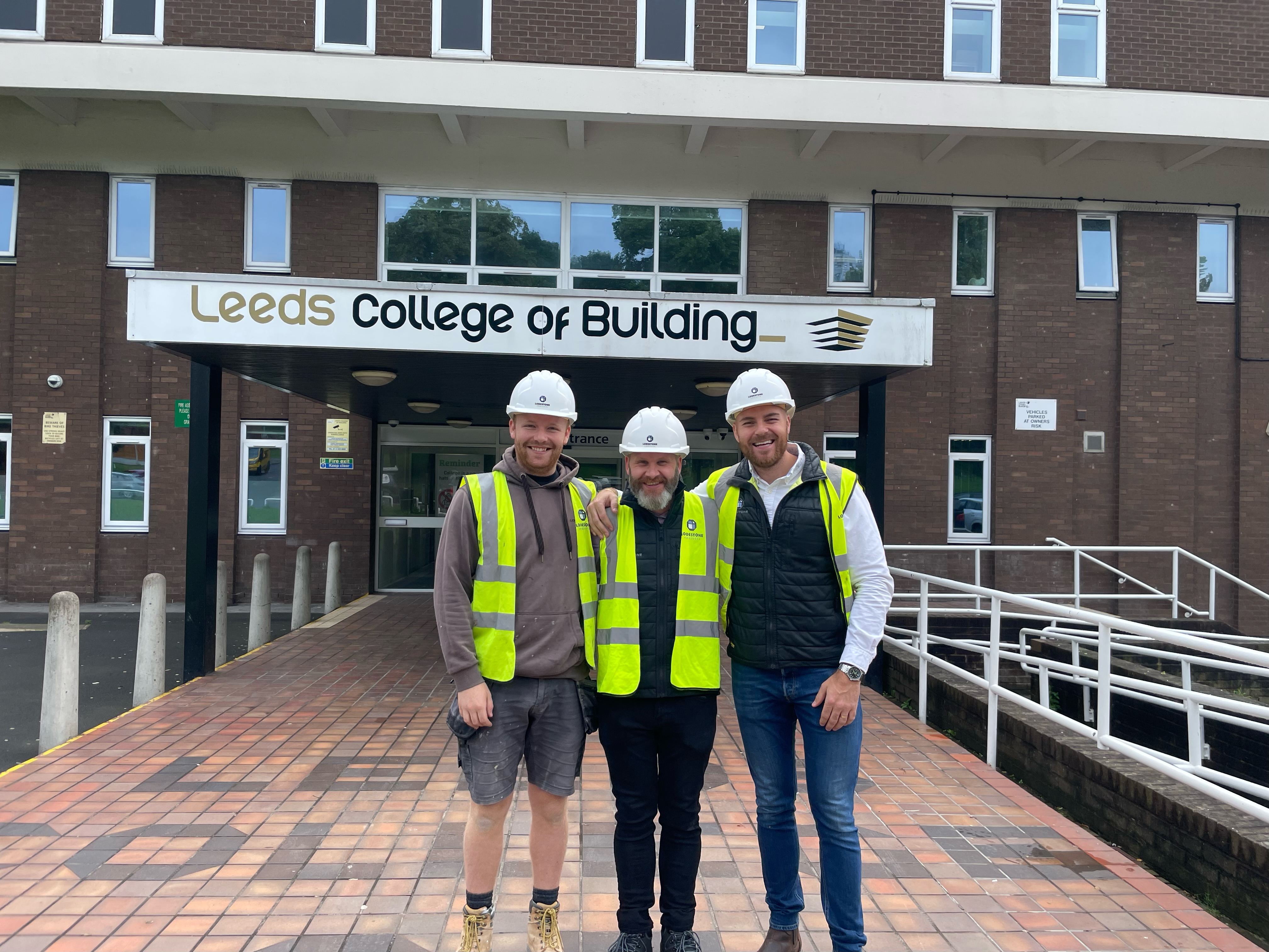 Image of three ex-LCB students wearing hi-vis jackets and hard hats.