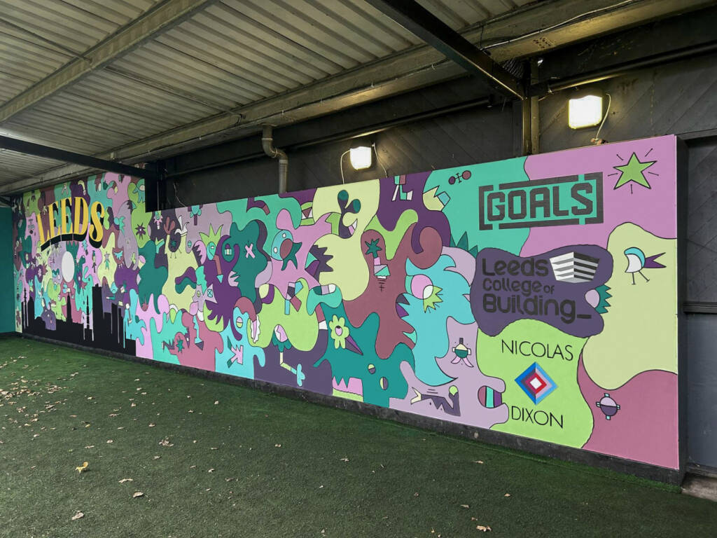 This is a photo of a mural that was painted by LCB students at the GOALS soccer centre in Kirkstall.