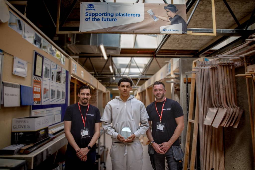 Image of Reece Williams stood between Ryan Seeley and Pete Baum, Skills Partnership Managers for British Gypsum