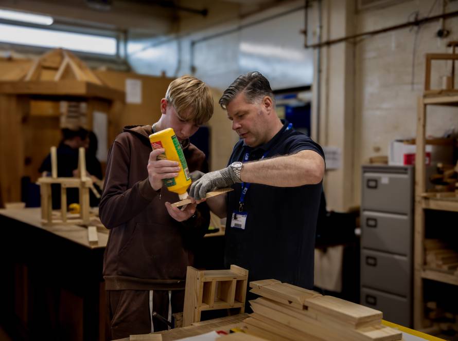 LCB Construction Crafts Lecturer Matthew Cattle working with LCB student on wooden 'Bug Hotel'.