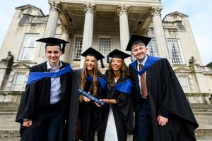This photo depicts Leeds College of Building Quantity Surveyor Degree Apprentices celebrating the colleges first ever graduation event.