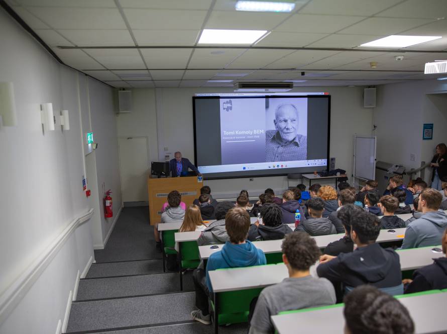 Holocaust survivor Tomi Komoly BEM addressing LCB's North Street Lecture Theatre