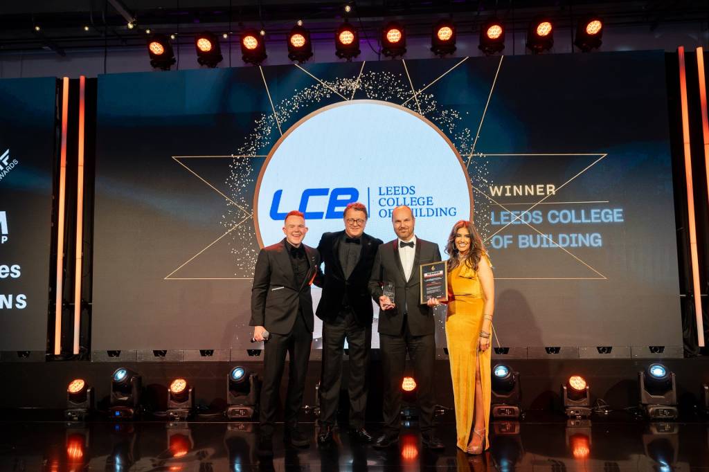 Assistant Principal Chris Tunningley with actor and presenter Colson Smith and CEO of the OM Group Damini Sharma.