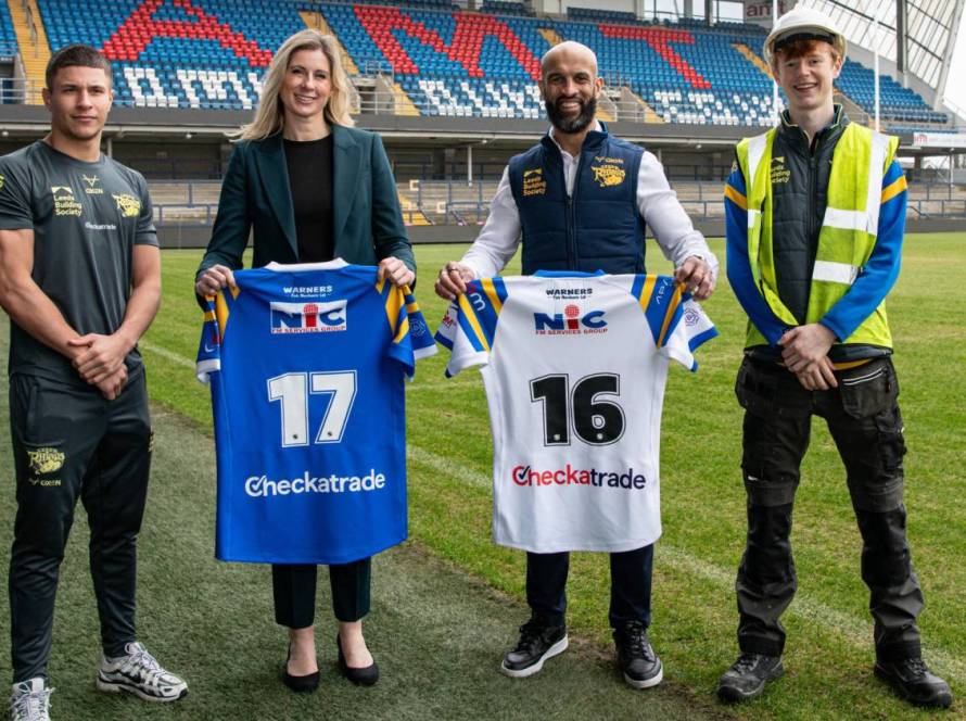 (L-R) Wade White, Leeds Rhino Academy player and apprentice; Emma Grant, Head of Trade Engagement, Checkatrade; Jamie Jones-Buchanan MBE, CEO, Leeds Rhinos; Finn Beaumont, apprentice at Leeds Rhinos stadium and attends Leeds College of Building.