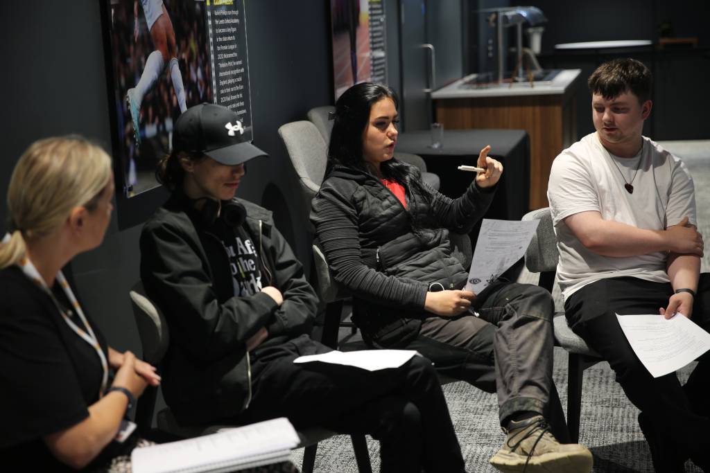 LCB students Niamh Ormsby speaking, Johnathan Kinghorn sat next to her (in white).