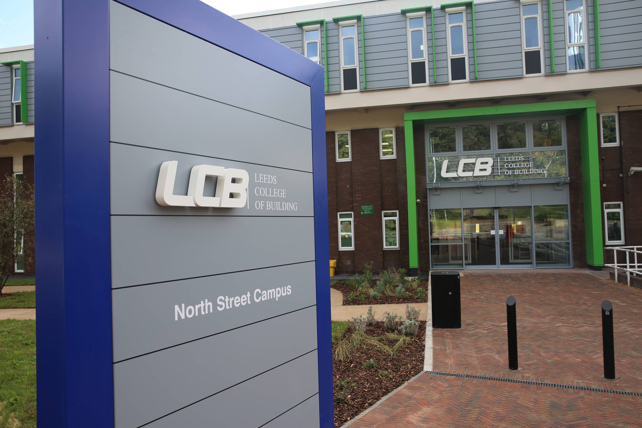This is a photo of Leeds College of Buildings North Street campus. This photo include the campuses front sign and main entrance.