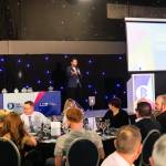 This photo depicts host Rich Williams giving an introductory speech at the awards.