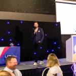 This photo depicts host Rich Williams giving an introductory speech at the awards.