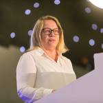 This photo depicts Leeds College of Buildings CEO & Principal, Nikki Davis, giving an introductory speech at the awards.
