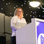 This photo depicts Leeds College of Buildings CEO & Principal, Nikki Davis, giving an introductory speech at the awards.