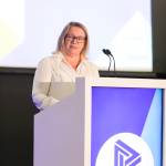 This photo depicts Leeds College of Buildings CEO & Principal, Nikki Davis, giving an introductory speech at the awards.