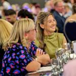 This photo depicts multiple guests at the awards sitting at their tables.