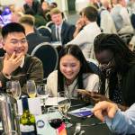 This photo depicts multiple guests at the awards sitting at their tables.