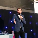 This photo depicts host Rich Williams giving an introductory speech at the awards.