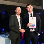 This photo depicts a student receiving their award.