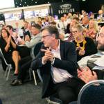 This photo depicts multiple guests at the awards sitting at their tables.