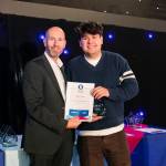 This photo depicts a student receiving their award.