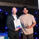 This photo depicts a student receiving their award.