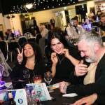 This photo depicts multiple guests at the awards sitting at their tables.