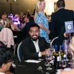 This photo depicts multiple guests at the awards sitting at their tables.