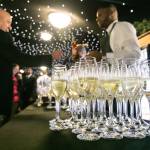 This photo depicts several glasses of drinks, intended to be handed out to guests as they enter the venue.