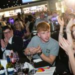 This photo depicts multiple guests at the awards sitting at their tables.