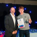 This photo depicts a student receiving their award.