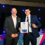 This photo depicts a student receiving their award.