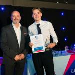 This photo depicts a student receiving their award.