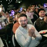 This photo depicts multiple guests at the awards sitting at their tables.