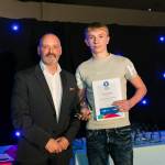 This photo depicts a student receiving their award.