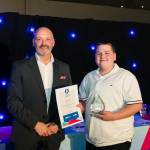 This photo depicts a student receiving their award.