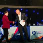 This photo depicts a student receiving their award.