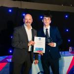 This photo depicts a student receiving their award.