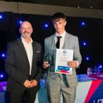 This photo depicts a student receiving their award.