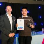 This photo depicts a student receiving their award.