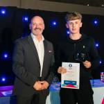 This photo depicts a student receiving their award.