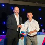 This photo depicts a student receiving their award.