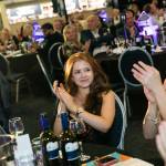 This photo depicts multiple guests at the awards sitting at their tables.