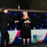 This photo depicts a student receiving their award.
