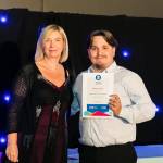 This photo depicts a student receiving their award.