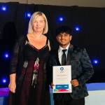 This photo depicts a student receiving their award.