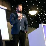This photo depicts host Rich Williams giving a closing speech at the awards.
