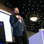 This photo depicts host Rich Williams giving a closing speech at the awards.