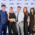 This photo depicts a staff team photo against the LCBU photo wall.