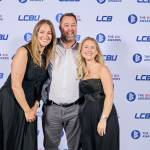 This photo depicts a staff team photo against the LCBU photo wall.