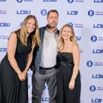 This photo depicts a staff team photo against the LCBU photo wall.