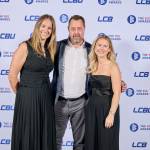 This photo depicts a staff team photo against the LCBU photo wall.